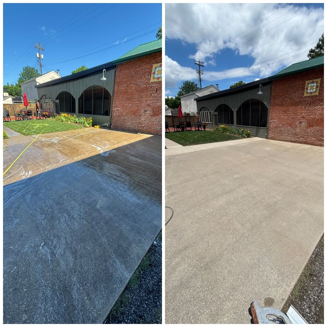 Before and after of a concrete driveway at a green and red-brick building with arched windows, rinsed clean of grime