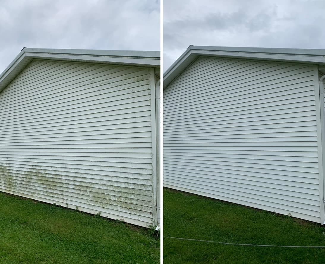 Before and after of the white vinyl gable end of an outbuilding, with green algae streaks washed away