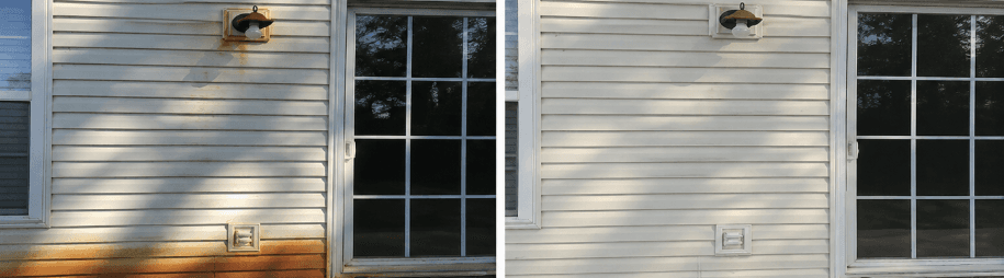 White vinyl siding before and after rust removal, with orange staining on the lower siding at left and clean white siding at right